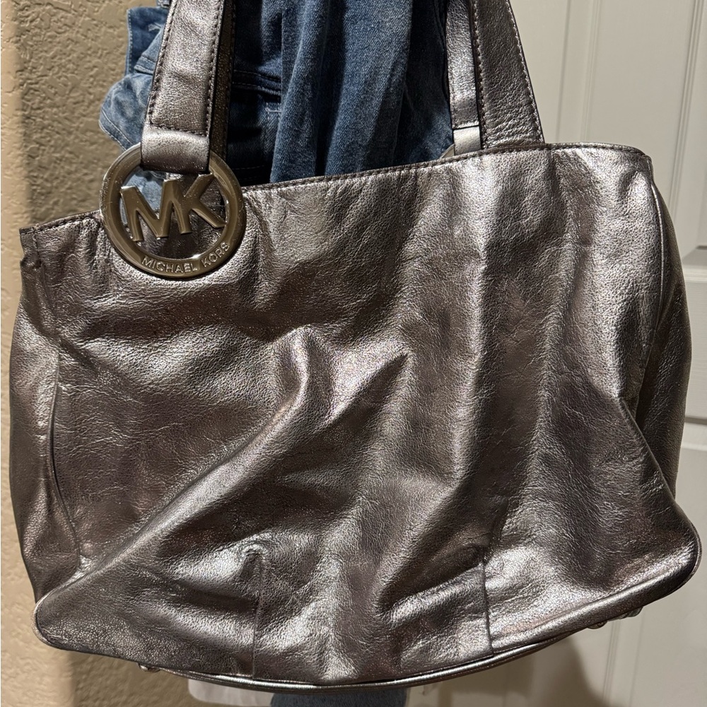 Vintage Michael Kors Fulton metallic silver bag in excellent used condition.